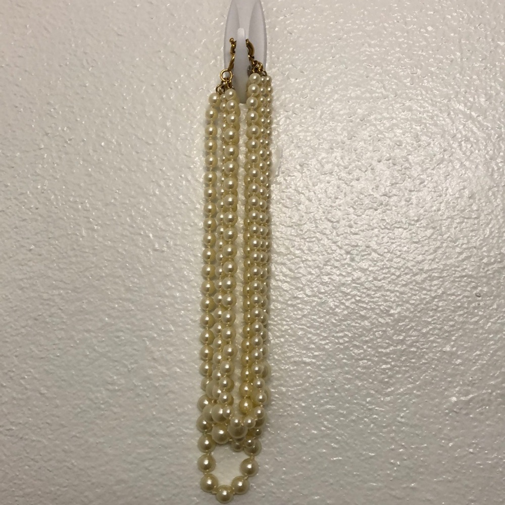 Multi strand cream colored faux pearl necklace
